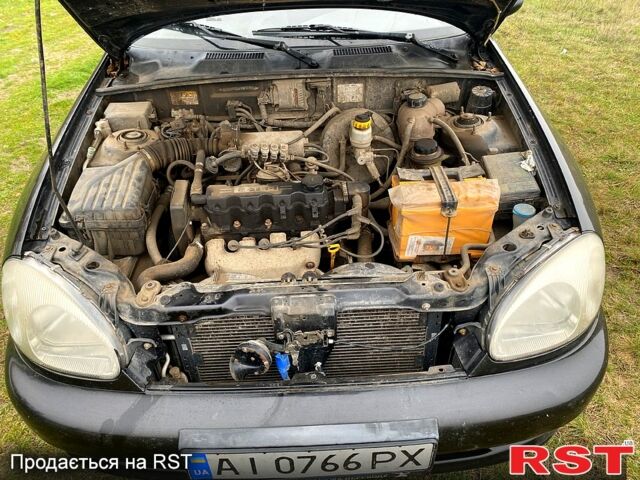 Чорний Деу Ланос, об'ємом двигуна 1.5 л та пробігом 256 тис. км за 1100 $, фото 9 на Automoto.ua