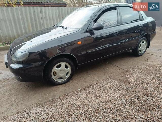 Черный Дэу Ланос, объемом двигателя 1.5 л и пробегом 200 тыс. км за 2100 $, фото 2 на Automoto.ua