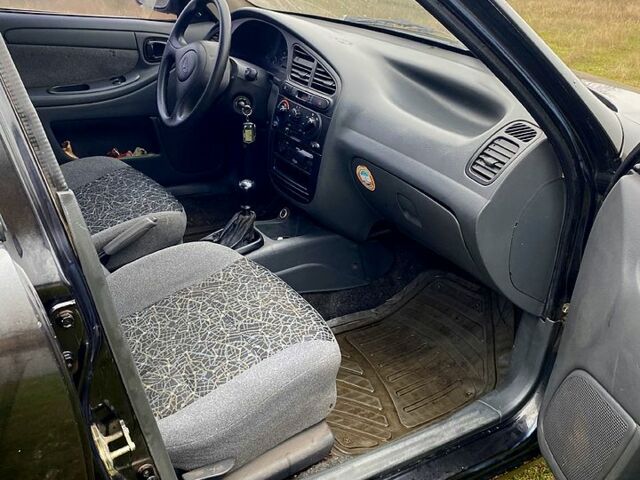 Чорний Деу Ланос, об'ємом двигуна 1.5 л та пробігом 256 тис. км за 1100 $, фото 6 на Automoto.ua