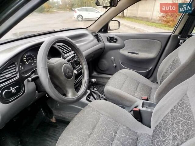 Черный Дэу Ланос, объемом двигателя 1.5 л и пробегом 351 тыс. км за 2000 $, фото 4 на Automoto.ua