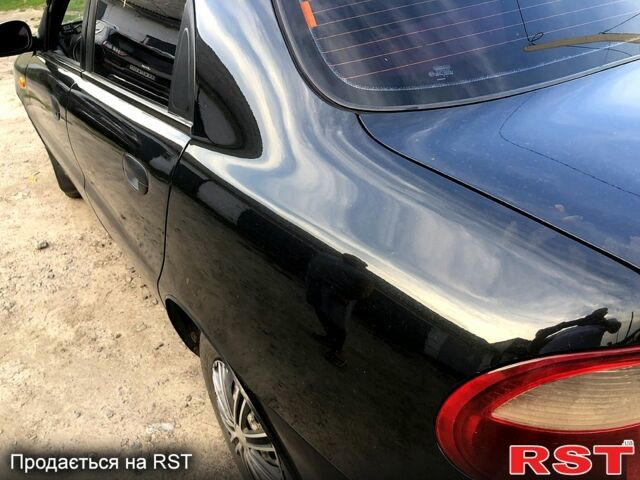 Черный Дэу Ланос, объемом двигателя 1.4 л и пробегом 50 тыс. км за 2250 $, фото 5 на Automoto.ua