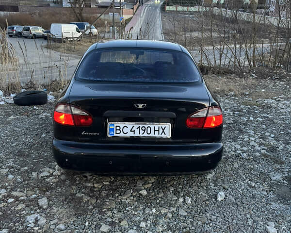 Черный Дэу Ланос, объемом двигателя 1.5 л и пробегом 313 тыс. км за 2400 $, фото 1 на Automoto.ua