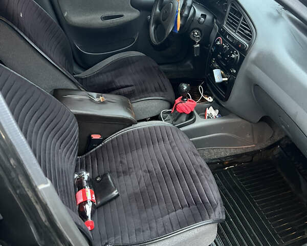 Черный Дэу Ланос, объемом двигателя 1.5 л и пробегом 161 тыс. км за 1950 $, фото 10 на Automoto.ua