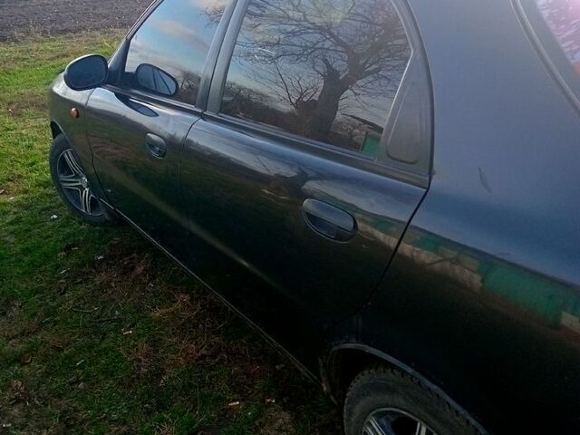 Черный Дэу Ланос, объемом двигателя 1.5 л и пробегом 286 тыс. км за 1000 $, фото 2 на Automoto.ua