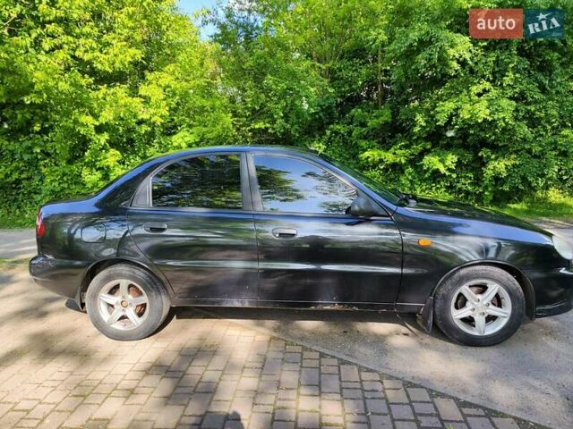 Черный Дэу Ланос, объемом двигателя 1.4 л и пробегом 165 тыс. км за 1450 $, фото 5 на Automoto.ua