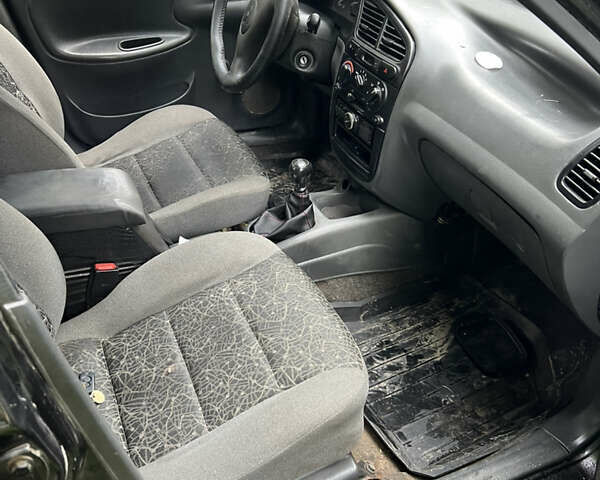 Черный Дэу Ланос, объемом двигателя 1.4 л и пробегом 260 тыс. км за 1200 $, фото 2 на Automoto.ua