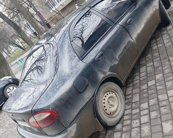 Чорний Деу Ланос, об'ємом двигуна 1.39 л та пробігом 320 тис. км за 1500 $, фото 6 на Automoto.ua