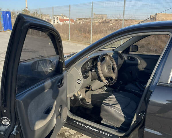 Черный Дэу Ланос, объемом двигателя 1.4 л и пробегом 177 тыс. км за 1750 $, фото 7 на Automoto.ua