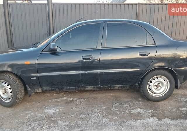 Черный Дэу Ланос, объемом двигателя 1.5 л и пробегом 222 тыс. км за 2350 $, фото 2 на Automoto.ua