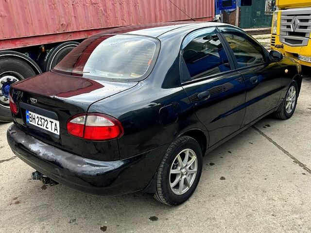 Черный Дэу Ланос, объемом двигателя 1.6 л и пробегом 287 тыс. км за 2400 $, фото 2 на Automoto.ua