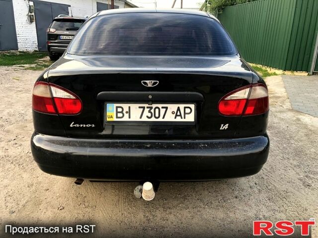 Черный Дэу Ланос, объемом двигателя 1.4 л и пробегом 50 тыс. км за 2250 $, фото 3 на Automoto.ua