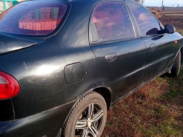 Черный Дэу Ланос, объемом двигателя 1.5 л и пробегом 286 тыс. км за 1000 $, фото 4 на Automoto.ua