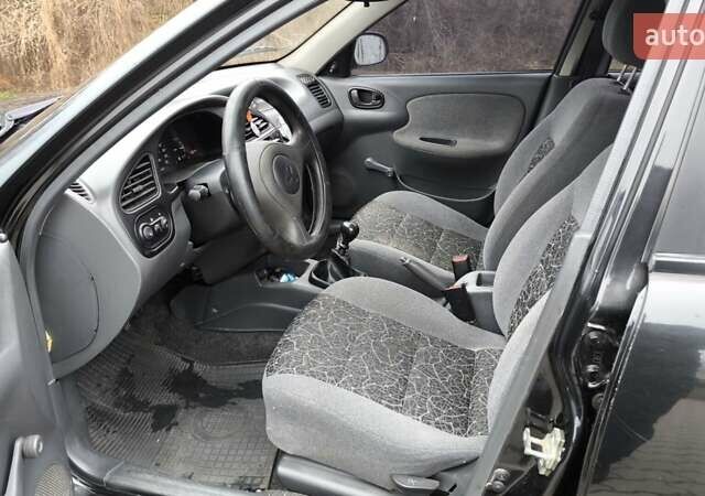 Черный Дэу Ланос, объемом двигателя 1.39 л и пробегом 213 тыс. км за 2300 $, фото 5 на Automoto.ua