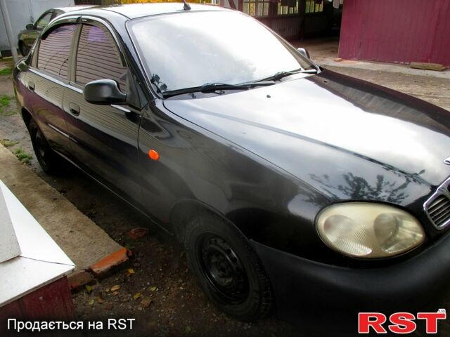 Черный Дэу Ланос, объемом двигателя 1.5 л и пробегом 230 тыс. км за 2000 $, фото 1 на Automoto.ua