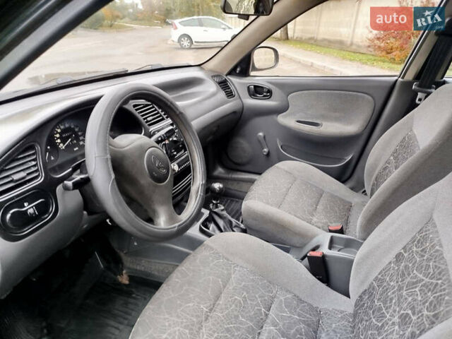 Черный Дэу Ланос, объемом двигателя 1.5 л и пробегом 350 тыс. км за 1800 $, фото 5 на Automoto.ua
