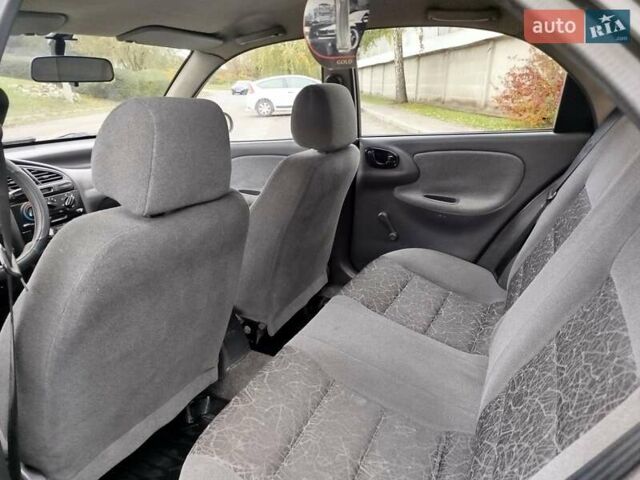 Черный Дэу Ланос, объемом двигателя 1.5 л и пробегом 351 тыс. км за 2000 $, фото 6 на Automoto.ua