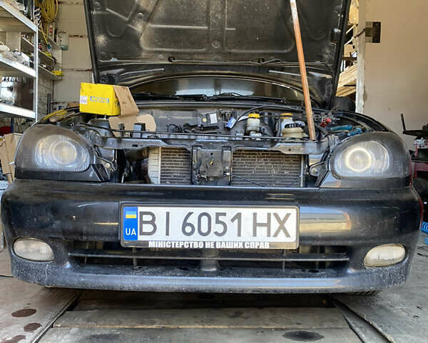Черный Дэу Ланос, объемом двигателя 1.5 л и пробегом 161 тыс. км за 1950 $, фото 28 на Automoto.ua