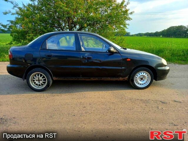 Черный Дэу Ланос, объемом двигателя 1.5 л и пробегом 368 тыс. км за 1150 $, фото 3 на Automoto.ua