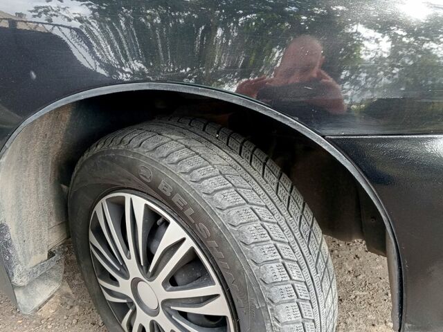 Черный Дэу Ланос, объемом двигателя 1.5 л и пробегом 213 тыс. км за 2400 $, фото 2 на Automoto.ua