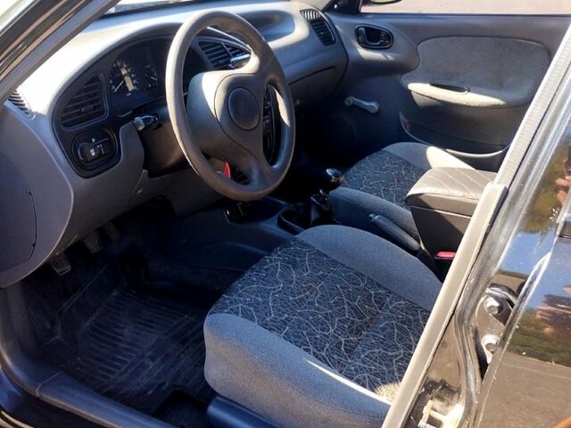 Черный Дэу Ланос, объемом двигателя 1.4 л и пробегом 155 тыс. км за 2199 $, фото 4 на Automoto.ua