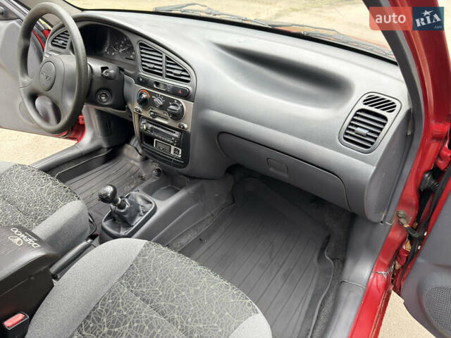 Черный Дэу Ланос, объемом двигателя 1.6 л и пробегом 156 тыс. км за 2400 $, фото 7 на Automoto.ua