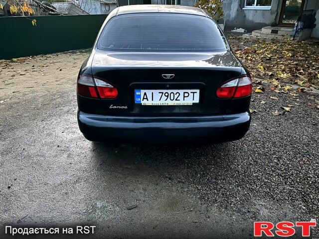 Черный Дэу Ланос, объемом двигателя 1.4 л и пробегом 220 тыс. км за 1800 $, фото 5 на Automoto.ua
