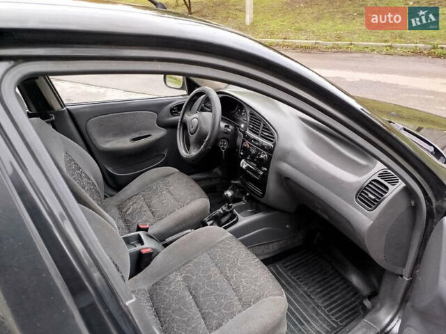 Черный Дэу Ланос, объемом двигателя 1.5 л и пробегом 350 тыс. км за 1800 $, фото 7 на Automoto.ua