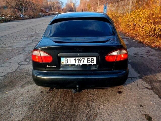 Чорний Деу Ланос, об'ємом двигуна 15 л та пробігом 211 тис. км за 3100 $, фото 1 на Automoto.ua