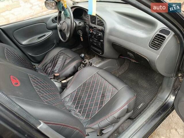 Черный Дэу Ланос, объемом двигателя 1.5 л и пробегом 200 тыс. км за 2100 $, фото 5 на Automoto.ua
