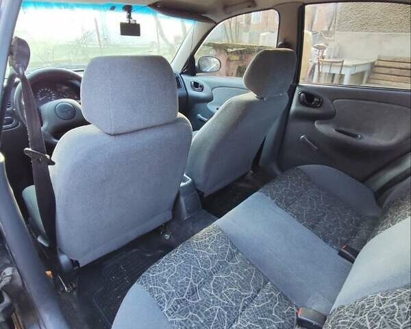 Черный Дэу Ланос, объемом двигателя 1.4 л и пробегом 165 тыс. км за 1450 $, фото 8 на Automoto.ua