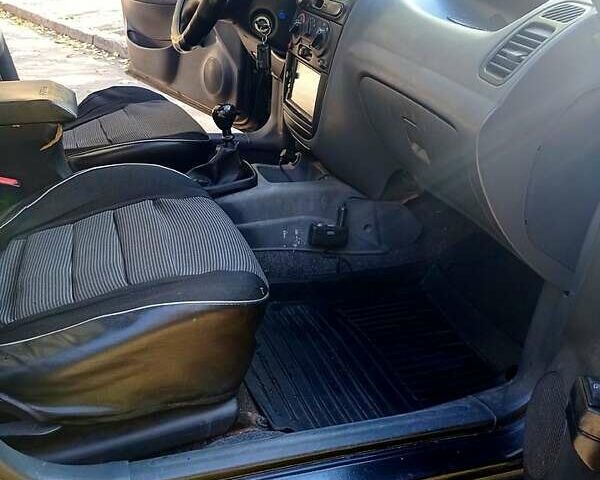 Черный Дэу Ланос, объемом двигателя 1.5 л и пробегом 365 тыс. км за 2000 $, фото 7 на Automoto.ua