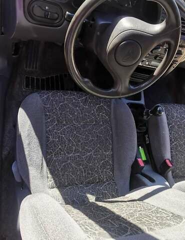 Черный Дэу Ланос, объемом двигателя 1.3 л и пробегом 160 тыс. км за 2000 $, фото 15 на Automoto.ua