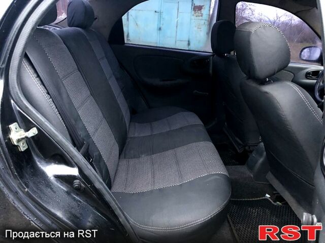 Чорний Деу Ланос, об'ємом двигуна 1.5 л та пробігом 198 тис. км за 1700 $, фото 5 на Automoto.ua