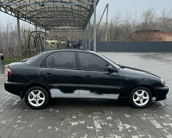 Черный Дэу Ланос, объемом двигателя 1.5 л и пробегом 161 тыс. км за 1950 $, фото 12 на Automoto.ua
