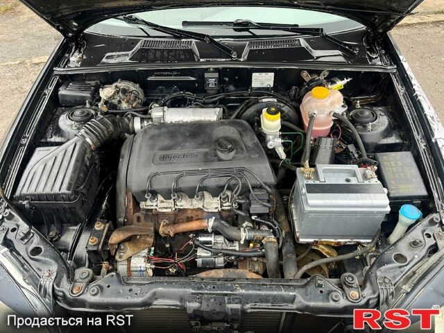 Черный Дэу Ланос, объемом двигателя 1.4 л и пробегом 202 тыс. км за 1400 $, фото 4 на Automoto.ua