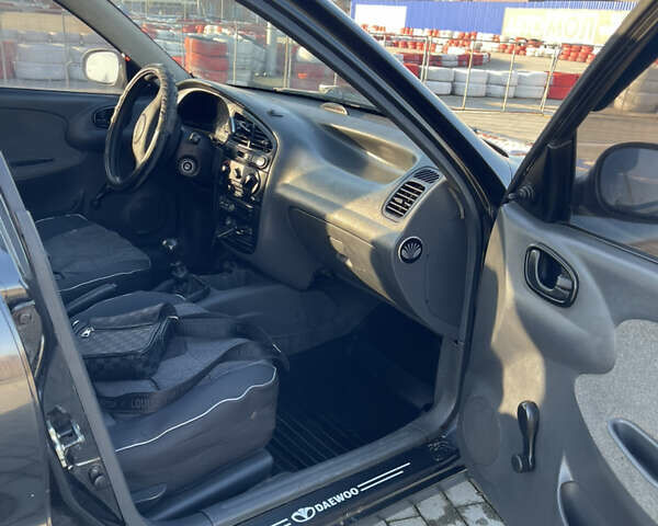 Черный Дэу Ланос, объемом двигателя 1.4 л и пробегом 177 тыс. км за 1750 $, фото 5 на Automoto.ua