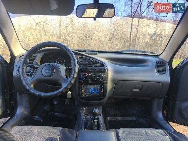 Черный Дэу Ланос, объемом двигателя 1.5 л и пробегом 216 тыс. км за 2699 $, фото 4 на Automoto.ua