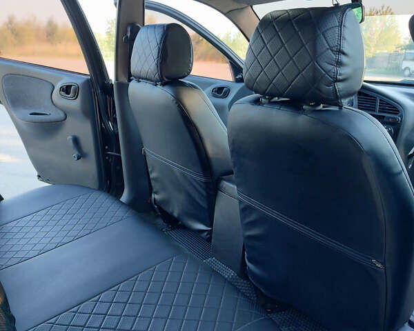 Черный Дэу Ланос, объемом двигателя 1.5 л и пробегом 160 тыс. км за 2500 $, фото 4 на Automoto.ua