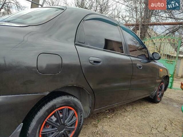 Черный Дэу Ланос, объемом двигателя 1.5 л и пробегом 365 тыс. км за 3000 $, фото 2 на Automoto.ua