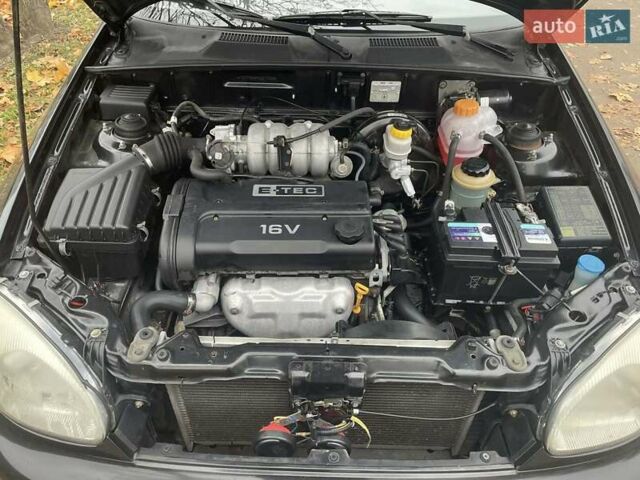 Черный Дэу Ланос, объемом двигателя 1.6 л и пробегом 170 тыс. км за 2400 $, фото 17 на Automoto.ua