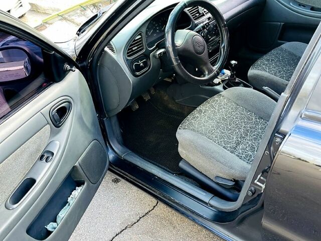 Черный Дэу Ланос, объемом двигателя 1.6 л и пробегом 326 тыс. км за 2700 $, фото 4 на Automoto.ua