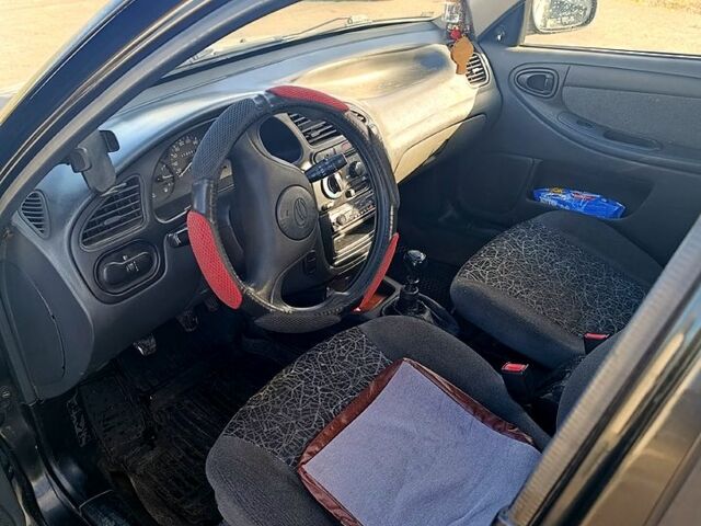 Деу Ланос 2009 у Жашкове на Automoto.ua Чорний Деу Ланос, об'ємом двигуна 1.5 л та пробігом 313 тис. км за 1650 $, фото 6 на Automoto.ua