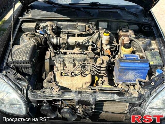 Черный Дэу Ланос, объемом двигателя 1.5 л и пробегом 162 тыс. км за 3100 $, фото 9 на Automoto.ua