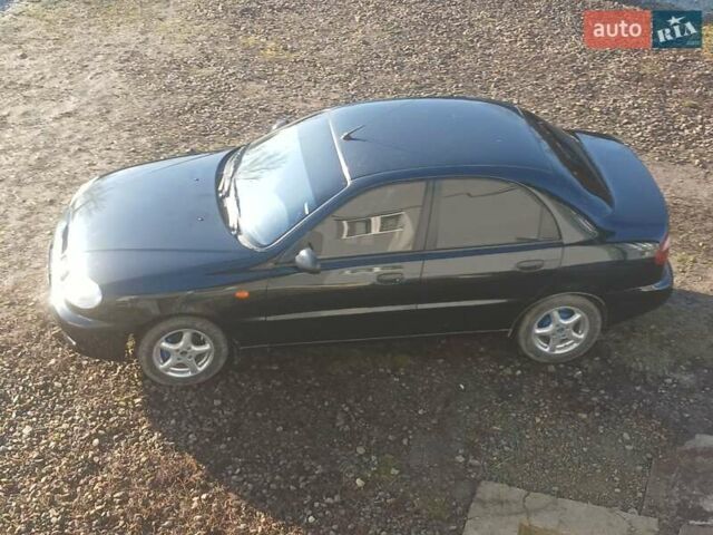 Черный Дэу Ланос, объемом двигателя 1.5 л и пробегом 76 тыс. км за 2300 $, фото 1 на Automoto.ua