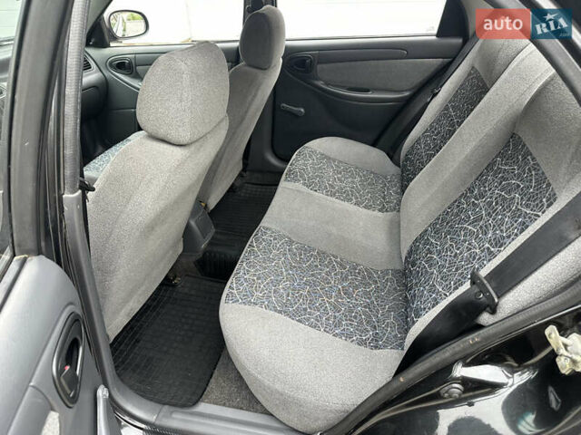 Черный Дэу Ланос, объемом двигателя 1.5 л и пробегом 158 тыс. км за 2850 $, фото 33 на Automoto.ua