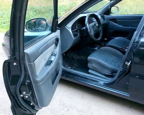 Чорний Деу Ланос, об'ємом двигуна 1.6 л та пробігом 174 тис. км за 2800 $, фото 24 на Automoto.ua