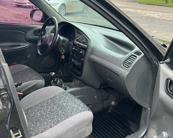 Черный Дэу Ланос, объемом двигателя 1.5 л и пробегом 270 тыс. км за 2550 $, фото 4 на Automoto.ua