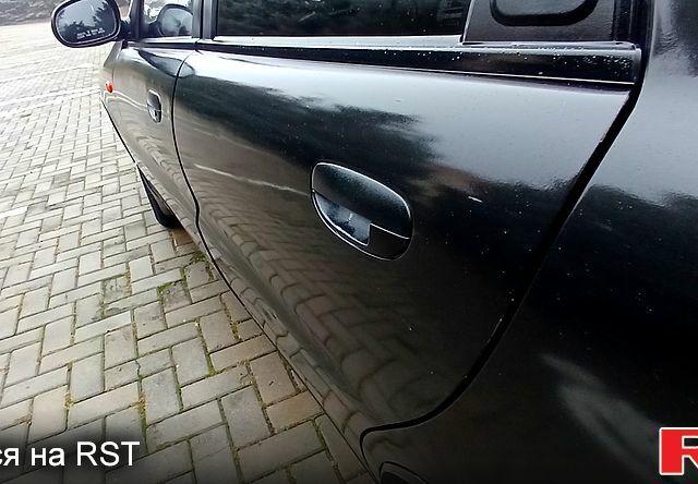 Черный Дэу Ланос, объемом двигателя 1.5 л и пробегом 170 тыс. км за 2500 $, фото 2 на Automoto.ua