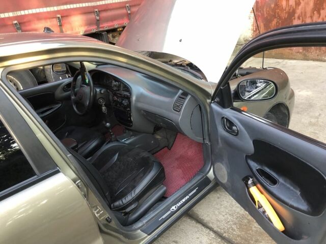 Коричневый Дэу Ланос, объемом двигателя 1.5 л и пробегом 302 тыс. км за 2300 $, фото 3 на Automoto.ua