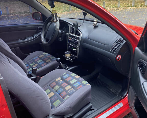 Красный Дэу Ланос, объемом двигателя 1.6 л и пробегом 235 тыс. км за 2350 $, фото 5 на Automoto.ua